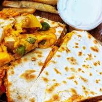 Buffalo Chicken Quesadilla · Breaded chicken basted in our homemade buffalo sauce, sautéed peppers & onions and pepper ja...