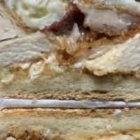 The Taki Taki · Chicken cutlet, melted Mozzarella, Bacon, Cole slaw & Russian dressing on a toasted garlic h...