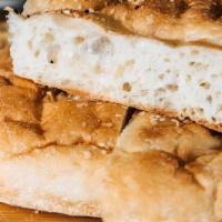 Turkish Pide Bread Loaf (Serves 4-6) · Bread: Loaf of focaccia-like Turkish pide

**Serves 4-6**: This signature, savory bread, whe...
