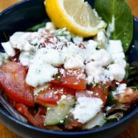 Nice Small Mediterranean Salad · Garden fresh mix of tomato and cucumber with a hint of dill, served over locally-sourced gre...