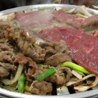 M-38. Ttukbaegi Bulgogi · House special soy sauce marinated beef in an earthenware pot.
