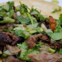 Taco De Carne Molida · onions cilantro guacamole lime and radish