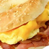 2 Huevos, Jamon Y Queso · 2 eggs any style ham and cheese roll or bagel
