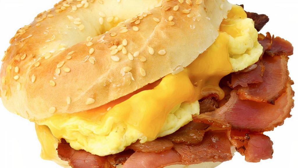2 Huevos, Tocino Y Queso · 2 eggs any style bacon and cheese roll or bagel