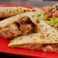Quesadilla Carnitas · fried pork , grilled quickly and served with flower tortillas. sour cream ,parmesan cheese,b...