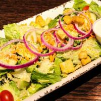 House Salad · Romaine lettuce, tomatoes, cucumbers, red onions, carrot strings, shredded cheese and croutons