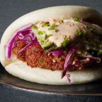 Fried Chicken Bao · Panko fried chicken, cabbage, black sesame seeds, togarashi, and your choice of sauce