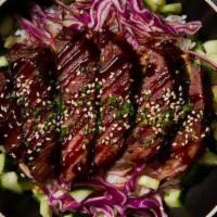 Bulgogi Beef Bowl · Thinly sliced Korean style beef served with cabbage slaw marinated in citrus ponzu, pickled ...