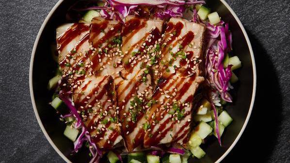 Original Pork Belly Bowl · Tender braised pork belly glazed with plum hoisin sauce, cabbage slaw marinated in citrus ponzu, pickled cucumbers, and choice of base