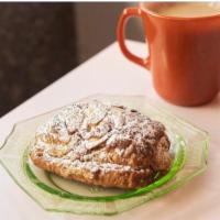 Almond Chocolate Croissant · twice-baked chocolate croissant filled with a toasted almond frangipane & dusted with confec...