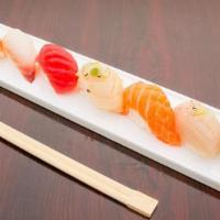Sushi Sampler Appetizer (7Pcs) · 7 Different Kind of Sashimi (Raw Fish) on Sushi Rice, Sushi (Fish with Rice).