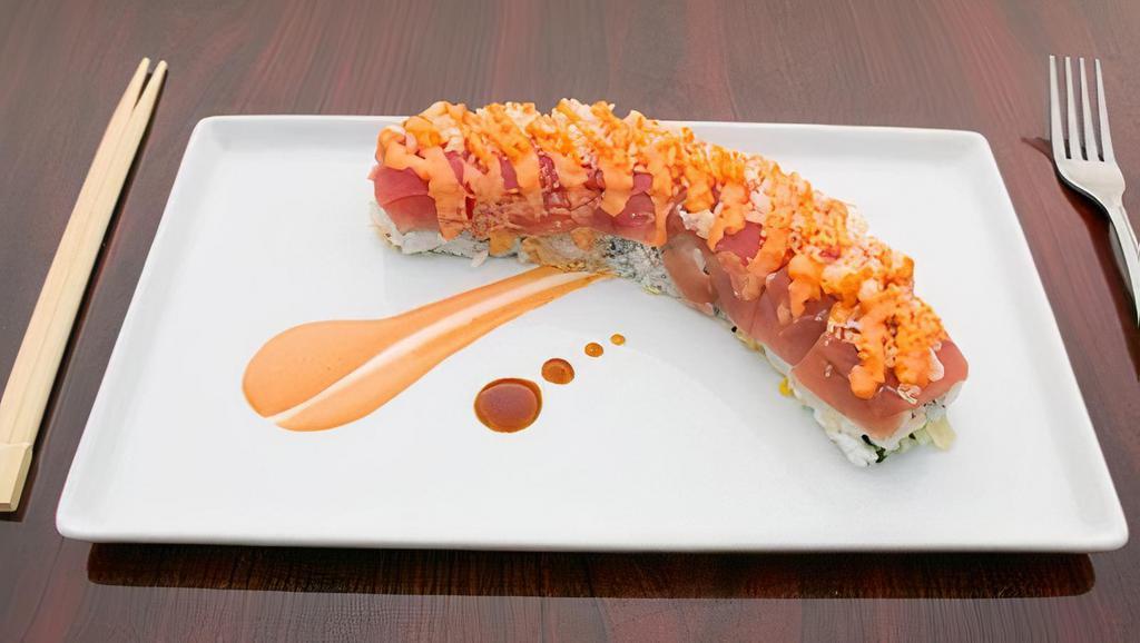 Pink Roll · Spicy. Eight pieces. Inside special salmon, cucumber, and tempura. Topped with tuna and tempura.