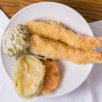 Shrimp & Vegetable Tempura Lunch Special · Sever  soup  or  salad   and  one sping roll   . 
 and  chioce   Rice  .