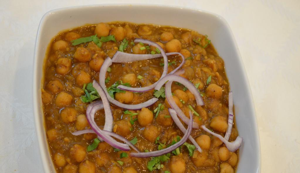 Channa Masala · Gluten-free. Vegan. Chickpeas cooked with traditional homemade spices.