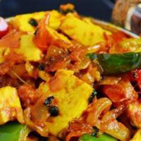 Paneer Kadai · Gluten-free. Cubes of homemade cheese cooked with onions, tomatoes and green pepper.