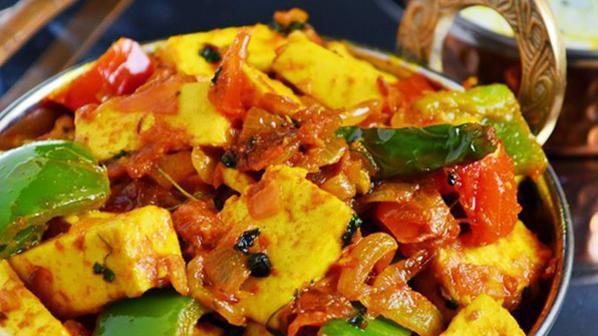 Paneer Kadai · Gluten-free. Cubes of homemade cheese cooked with onions, tomatoes and green pepper.