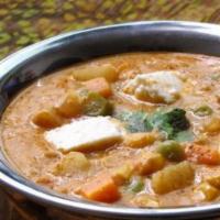 Navratan Korma · Gluten-free. Vegan. Mixed vegetables cooked in delicate spices, tomatoes and onions.