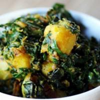 Saag Aloo · Vegan. Gluten-free. Potatoes smothered in freshly ground spinach.