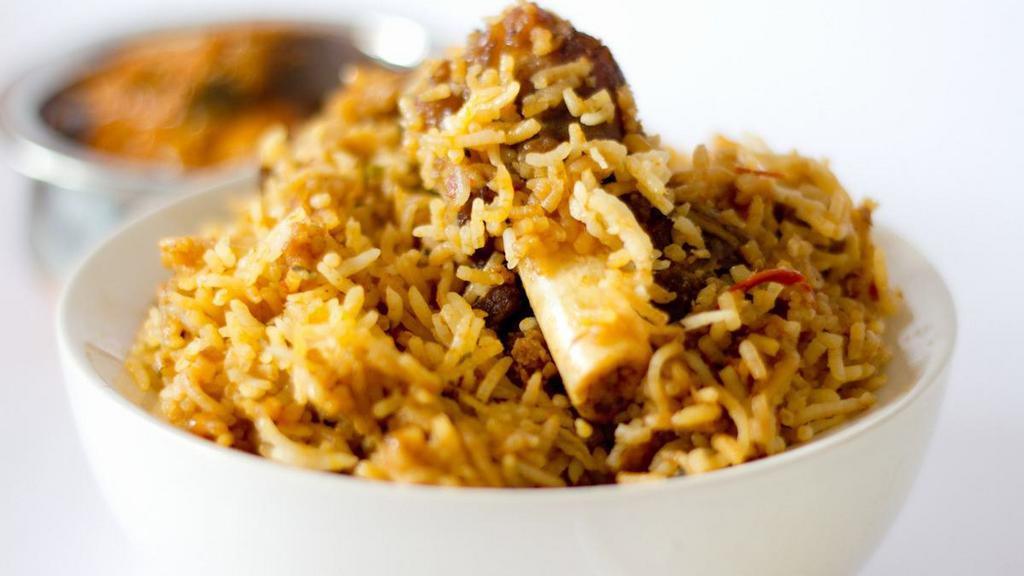 Goat Biryani · Gluten-free. Selected royal portions of goat cooked in herb and spices with fragrant basmati rice.