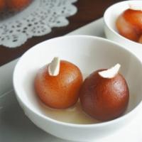 Gulab Jamun · Gluten-free. Deep-fried evaporated milk balls, served in natural honey syrup.