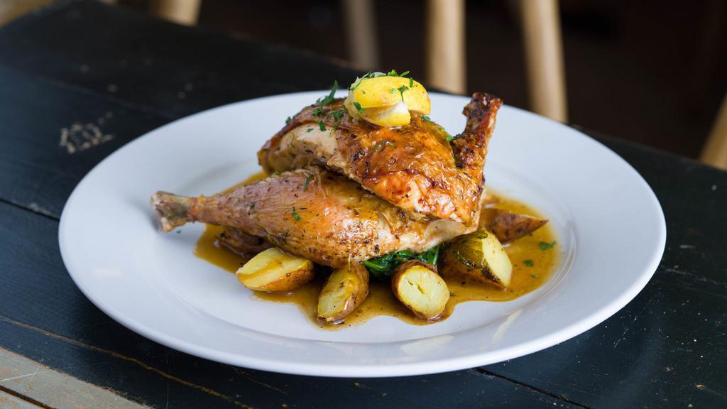 Roasted Half Organic Chicken · Half roasted organic chicken. Served au jus with roasted fingerling potatoes and wilted spinach.