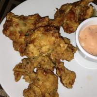 Chicken Lolly Pop · Chicken wings with an aromatic marinated fried in a light batter. Spicy.