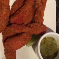 Tangra Masala Fish Finger · Fresh tilapia marinated with flavorful house masala and fried crispy. Spicy.