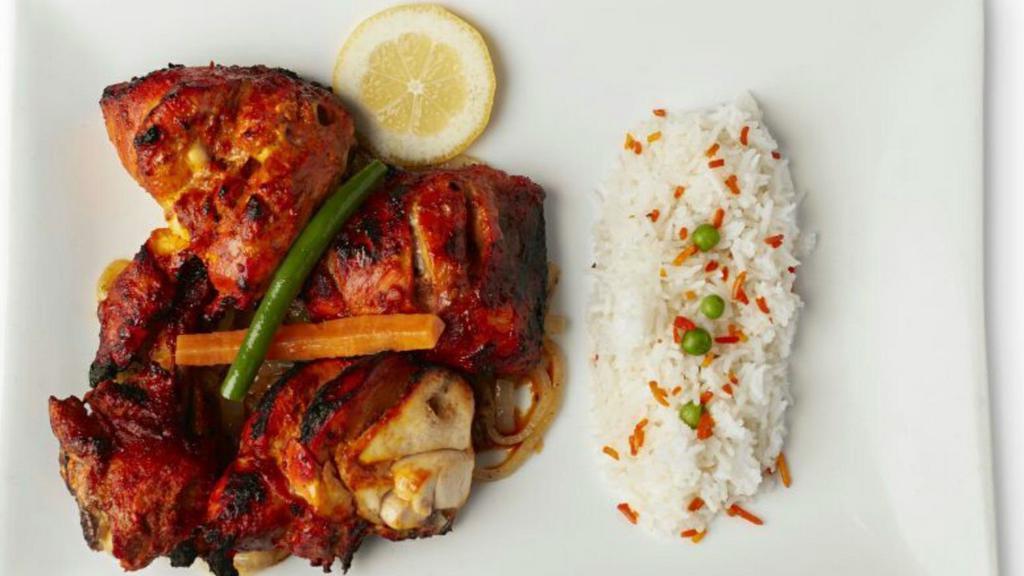 Chicken Tandoori · Chicken marinated overnight in cultured yogurt & spices, then  grilled on skewers.