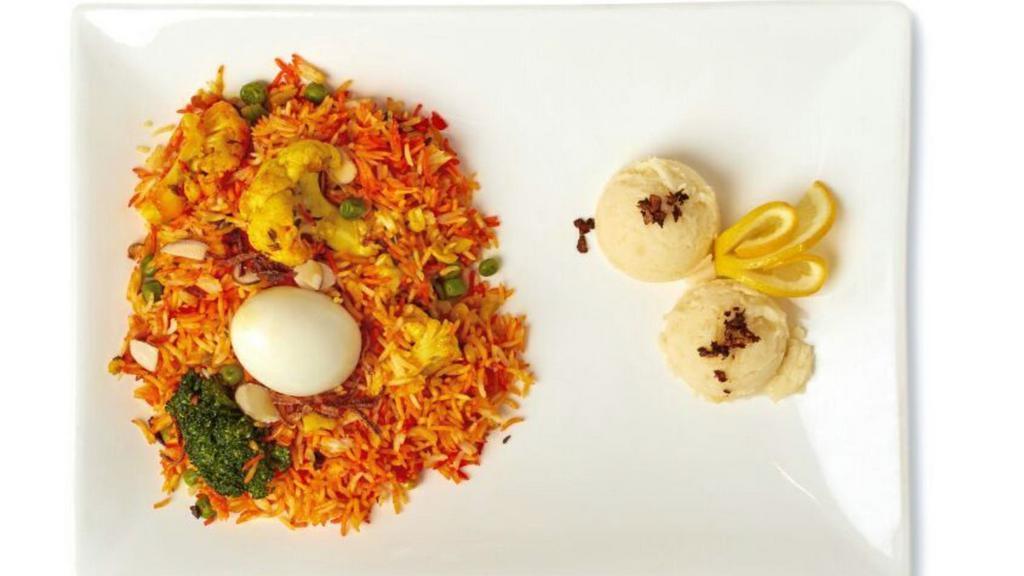 Vegetable Biryani · Vagatable cooked with basmati rice served with egg.