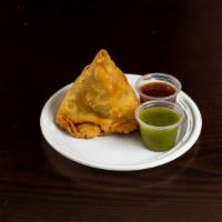 Samosa · 1 piece Dumpling stuffed with potatoes and fresh peas. Deep fried.