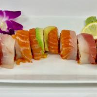 Rainbow Roll · Crab, tobiko, cucumber topped with salmon, tuna, white tuna and avocado.