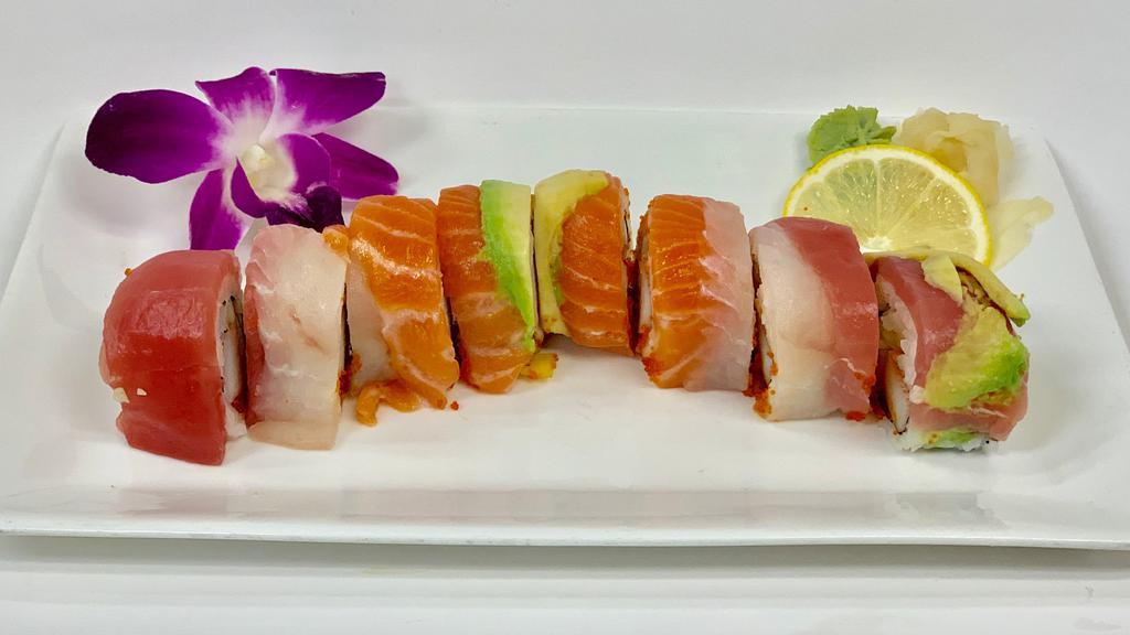 Rainbow Roll · Crab, tobiko, cucumber topped with salmon, tuna, white tuna and avocado.