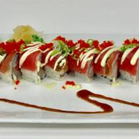 Tony Tiger Roll · Salmon, tuna, yellowtail, shrimp. Tobiko top with seared tuna and wasabi mayo and scallions.