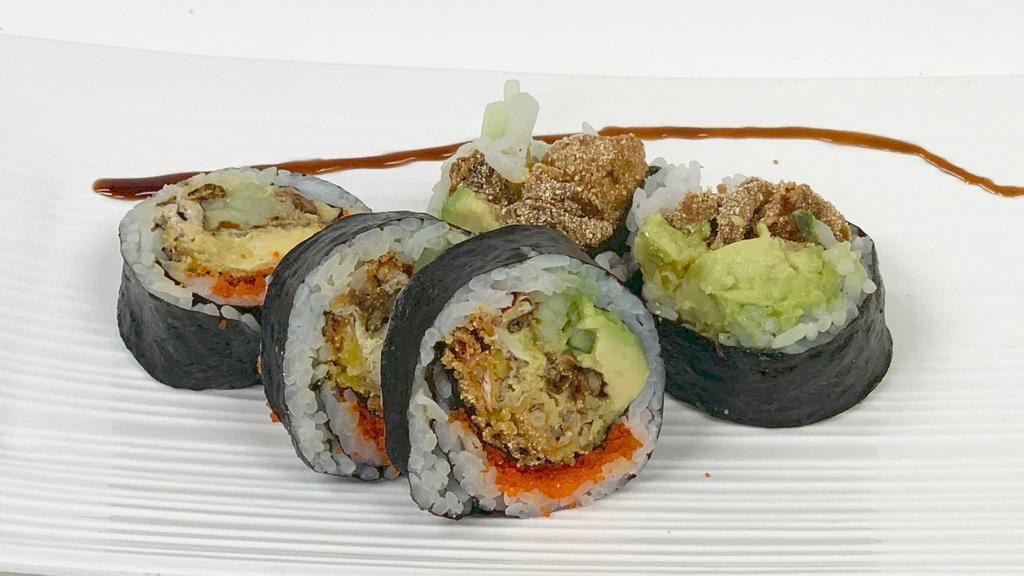 Spider Roll · Fried soft shell crab, cucumber avocado and tobiko.