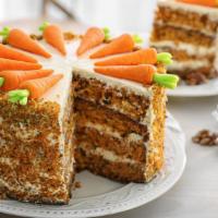 Carrot Cake · Sweet and moist spice cake, full of cut carrots and toasted nuts.