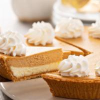 Pumpkin Cheesecake · A rich and creamy New York-style cheesecake baked inside a honey-graham crust with pumpkins.