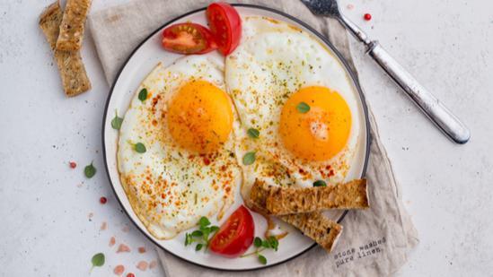 Two Egg Omelette Breakfast · Fluffy two egg omelette served with toast, home fries, and small tea or coffee.