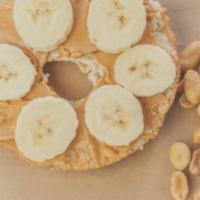 Bagel With Peanut Butter & Banana · Fresh bagel with peanut butter and slices of banana.