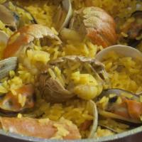 Paelha · Seafood combination in yellow rice. Serves for two.