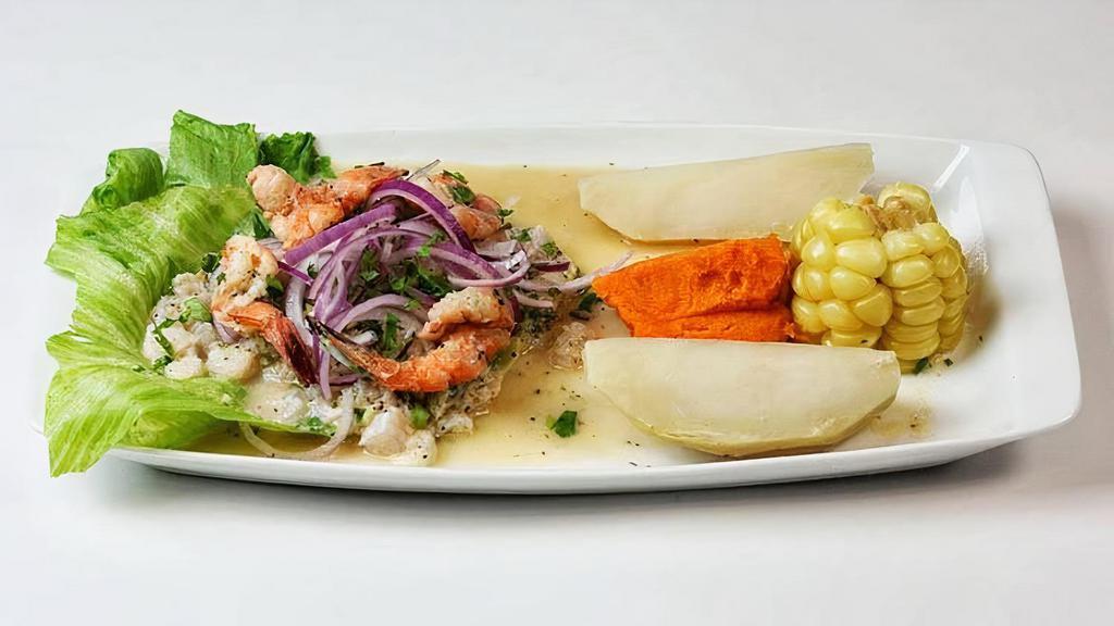 Ceviche De Camarones · Shrimp ceviche. Shrimp (16) marinated in lime juice mixed with red onions, cilantro and rocoto hot pepper. Served with sweet potato over Peruvian corn.
