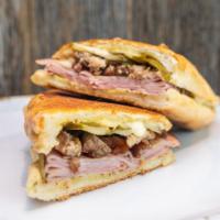 Cubano · Roasted pork shoulder, sliced ham, Swiss cheese, pickles, dijonnaise.