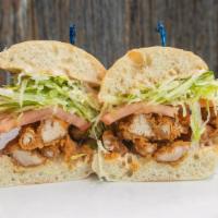 Fried Chicken Sandwich · Fried chicken thighs, chipotle ranch, tomato, shaved iceberg. Served on ciabatta.
