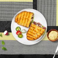 Russian Panini · Roasted beef, Muenster cheese, caramelized onions, lettuce, plum tomatoes, and Russian dress...