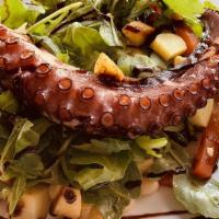 Octopus A La Plancha · Grilled octopus,fingerling potatoes, arugula, white beans, jalapeños, balsamic-cilantro vina...