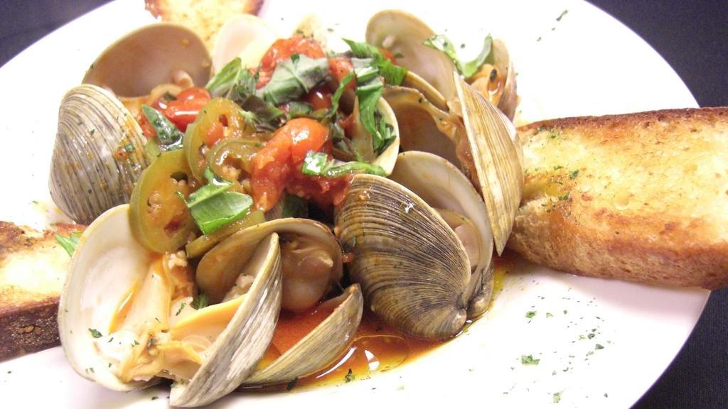 Clams Arrabbiata (Mgf) · Dozen fresh clams in a spicy filetto di pomodoro sauce with pancetta, pepperoncino peppers and basil. Garnish with grilled Tuscan bread and drizzled with extra virgin olive oil from Puglia Italy.(MGF) Can be modified gluten free