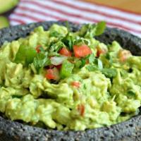 Homemade Guacamole · Traditional fresh guacamole served with tortilla chips.