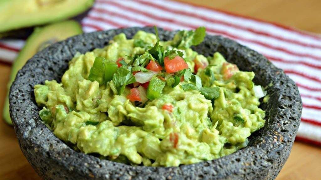 Homemade Guacamole · Traditional fresh guacamole served with tortilla chips.