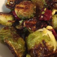 Crispy Brussels Sprouts · Contains nut/nut allergy. Sriracha hint, lemon juice, dried cranberries, pistachios, and hon...