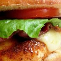 Grilled Chicken Sandwich · Organic chicken breast, smoked slab bacon, cheddar cheese, lettuce, tomato onions, and chipo...