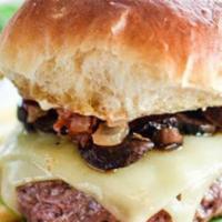 Truffle Burger · Topped with mushrooms, summer black truffle, braised vidalia onions, and brie cheese.